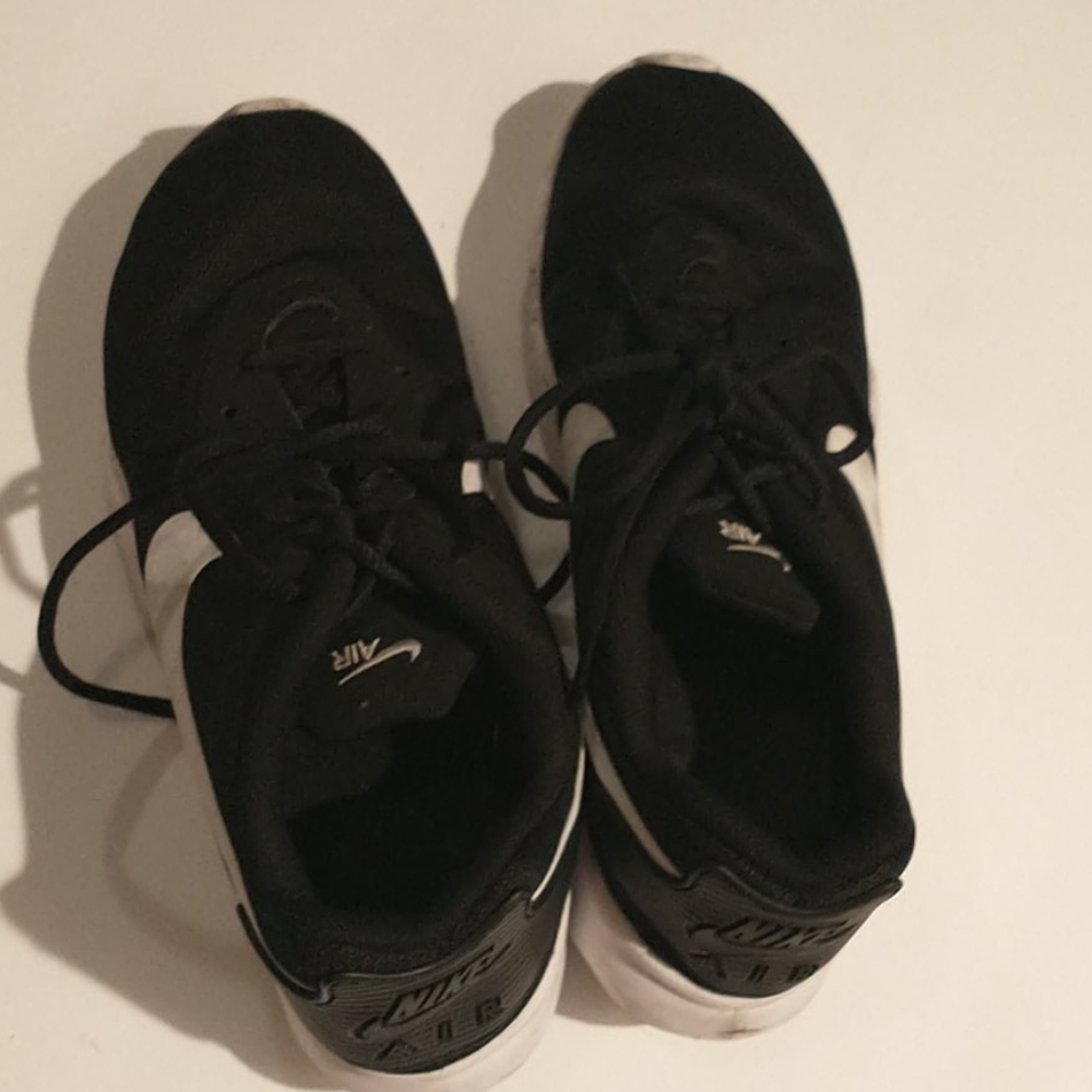 Black Nike Air athletic shoes